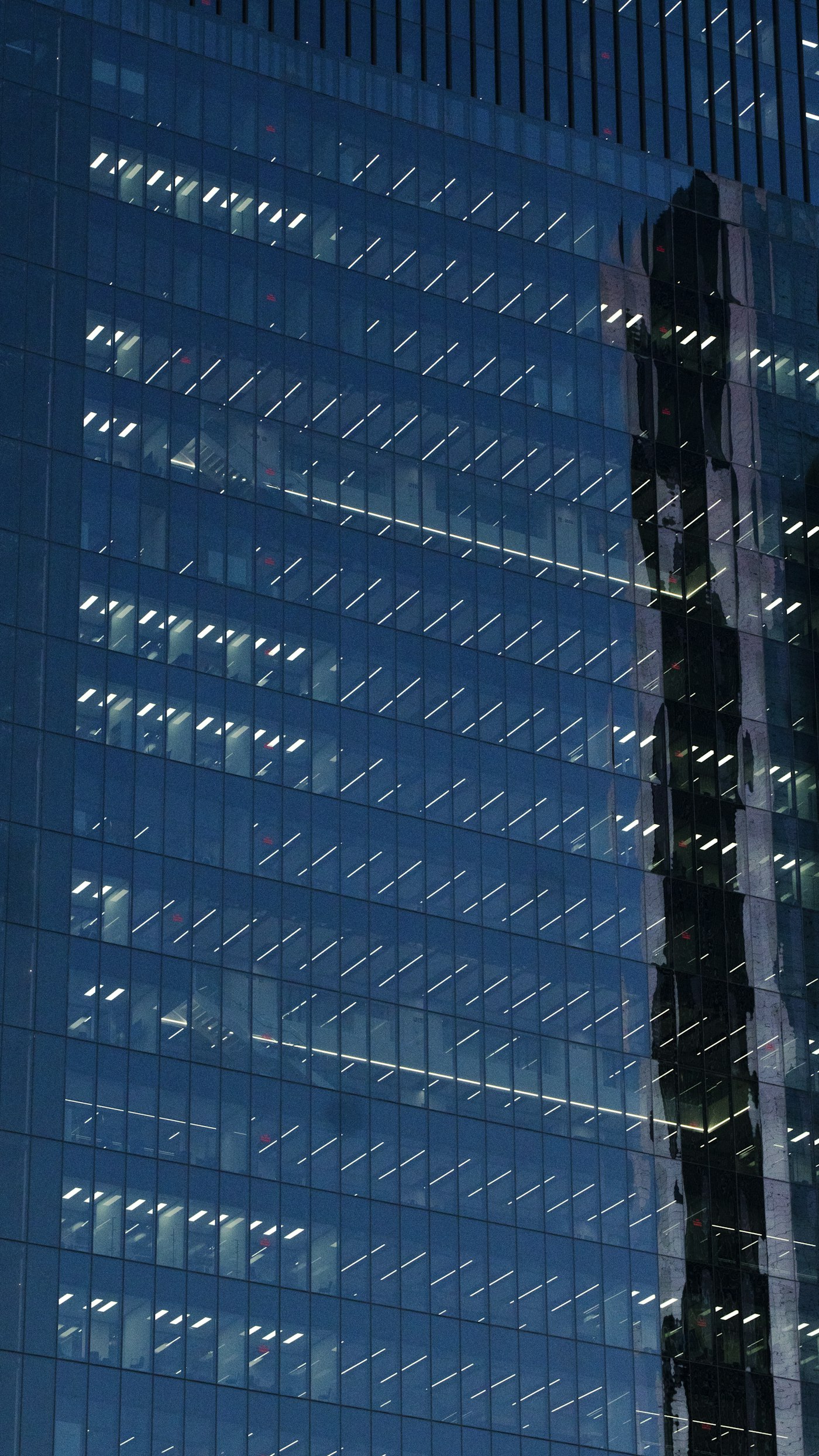 Glass office tower at night